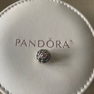 Pandora blooming rose charm with pink stone